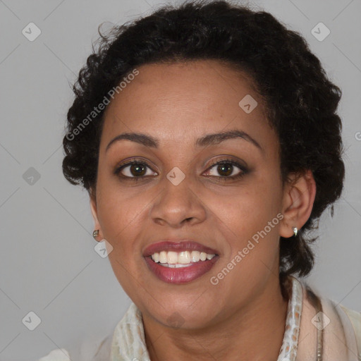 Joyful black adult female with medium  brown hair and brown eyes