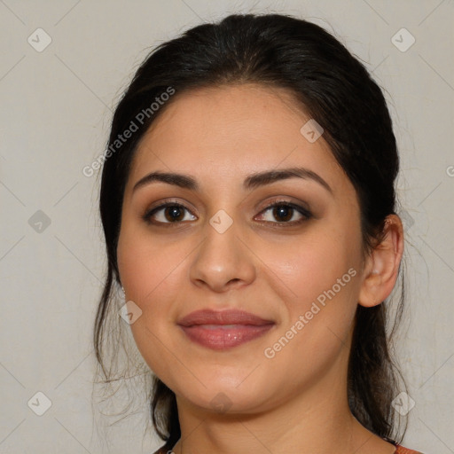 Joyful latino young-adult female with medium  brown hair and brown eyes