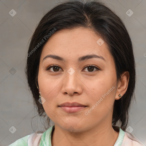 Joyful asian young-adult female with medium  brown hair and brown eyes