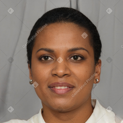 Joyful black young-adult female with short  brown hair and brown eyes