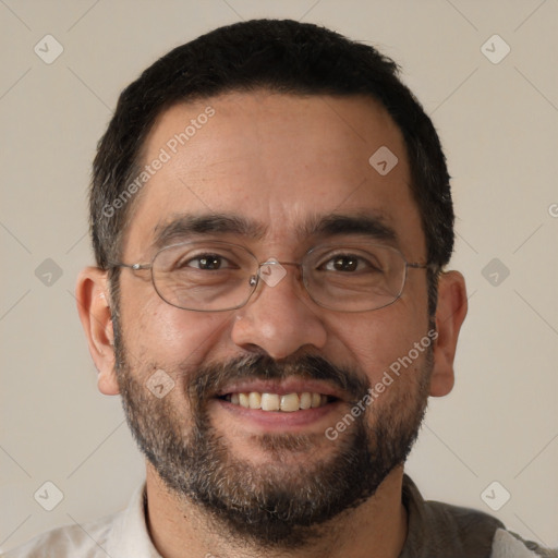 Joyful white adult male with short  black hair and brown eyes