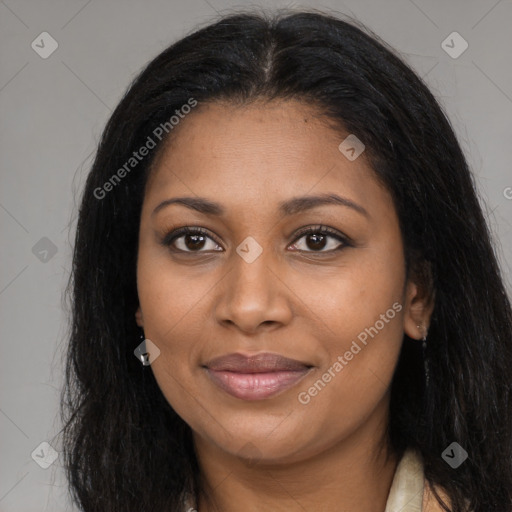 Joyful black young-adult female with long  brown hair and brown eyes