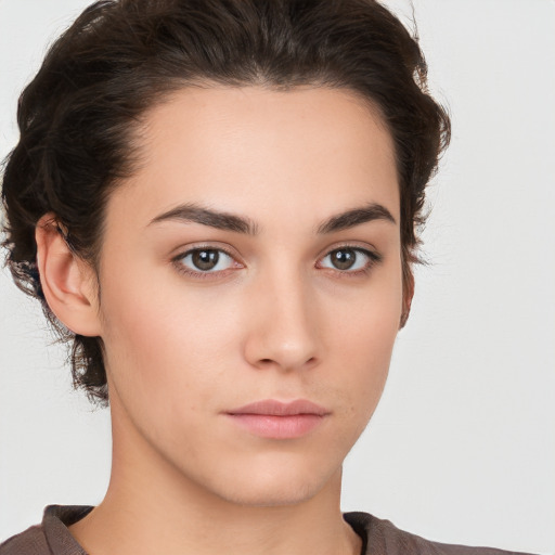 Neutral white young-adult female with medium  brown hair and brown eyes