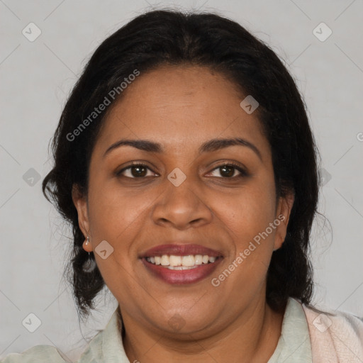 Joyful black adult female with medium  brown hair and brown eyes