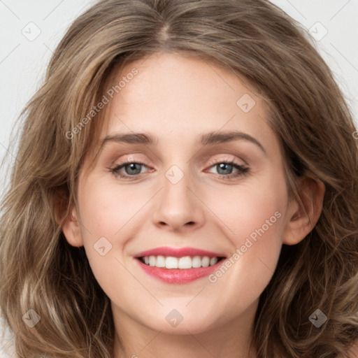 Joyful white young-adult female with long  brown hair and grey eyes