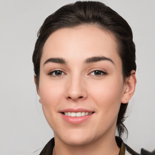 Joyful white young-adult female with medium  brown hair and brown eyes