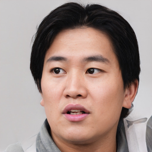 Neutral asian young-adult male with medium  black hair and brown eyes