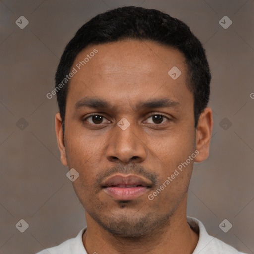 Neutral latino young-adult male with short  black hair and brown eyes