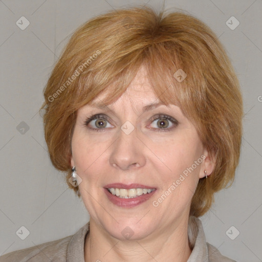 Joyful white adult female with medium  brown hair and blue eyes