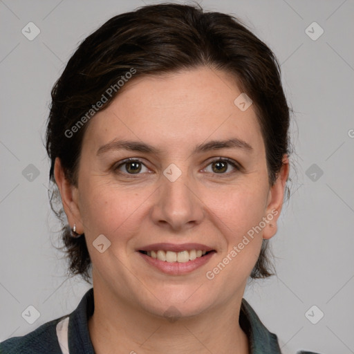 Joyful white adult female with medium  brown hair and grey eyes