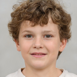 Joyful white child male with short  brown hair and brown eyes