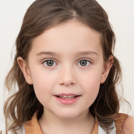 Joyful white child female with medium  brown hair and blue eyes