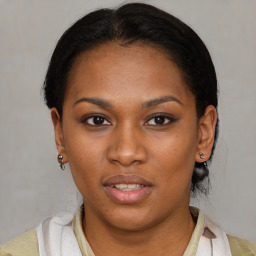 Joyful latino young-adult female with short  brown hair and brown eyes