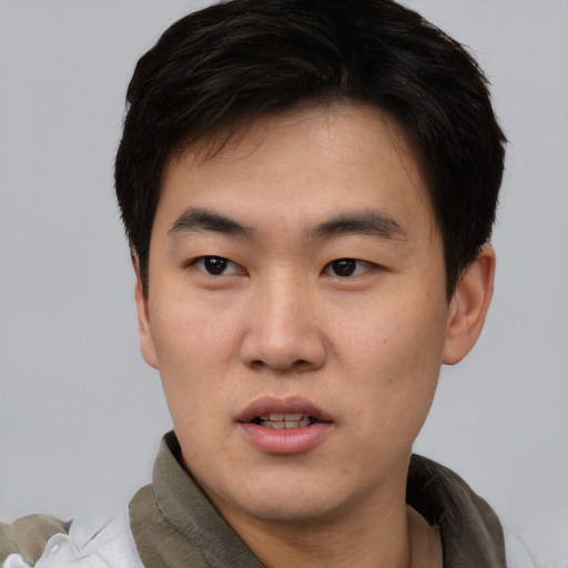 Neutral asian young-adult male with short  black hair and brown eyes