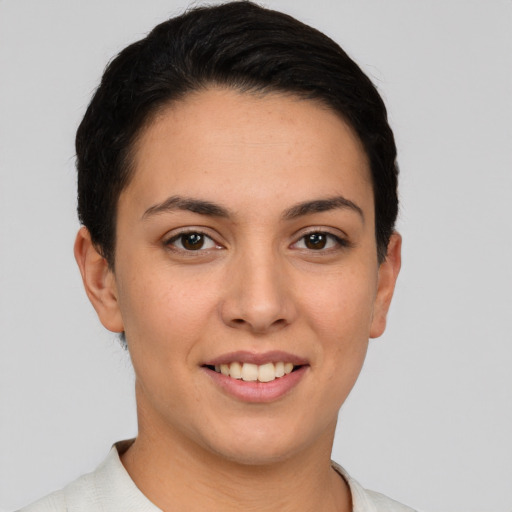 Joyful white young-adult female with short  brown hair and brown eyes