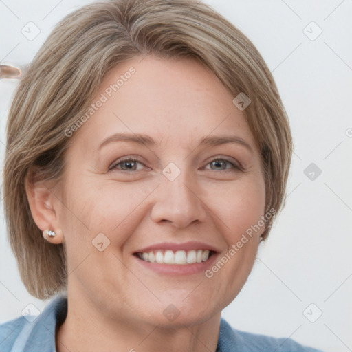 Joyful white adult female with medium  brown hair and blue eyes