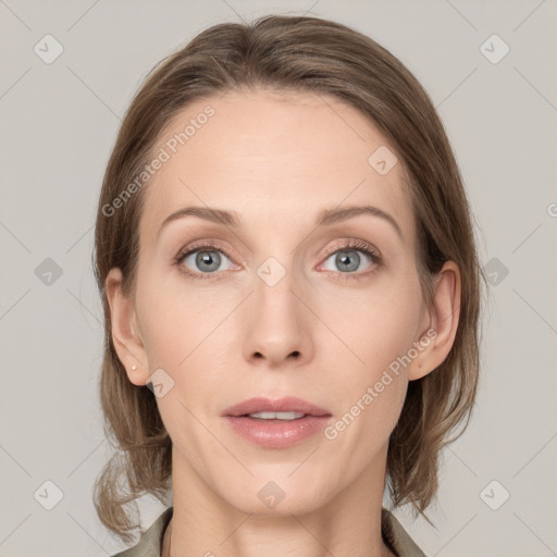 Joyful white adult female with medium  brown hair and grey eyes