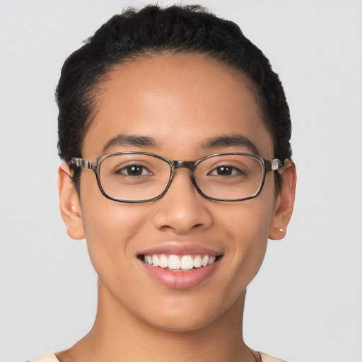 Joyful latino young-adult female with short  brown hair and brown eyes