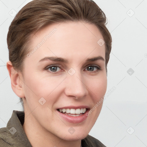 Joyful white young-adult female with short  brown hair and grey eyes