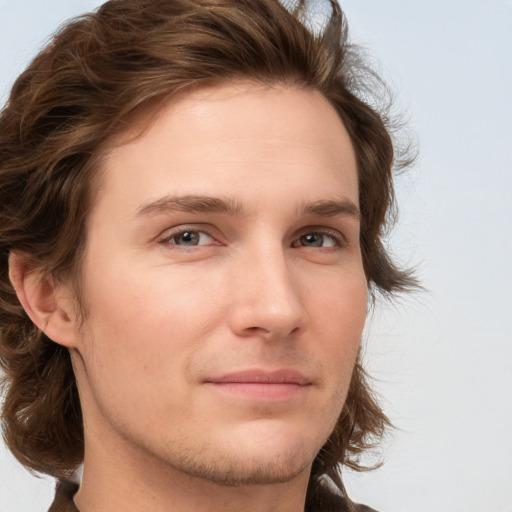 Joyful white young-adult male with medium  brown hair and brown eyes