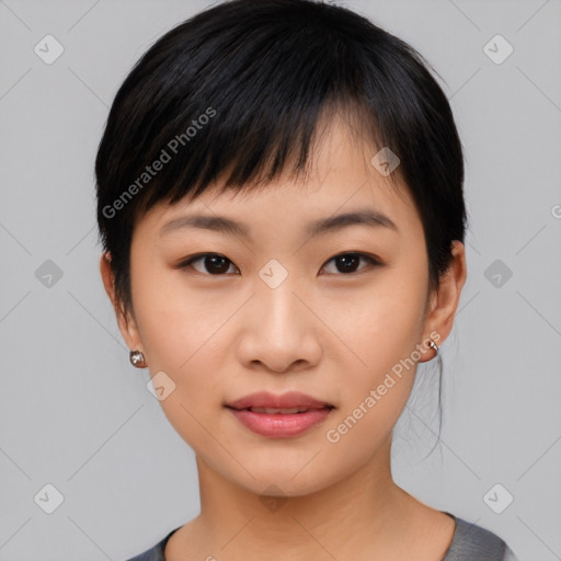 Joyful asian young-adult female with short  black hair and brown eyes