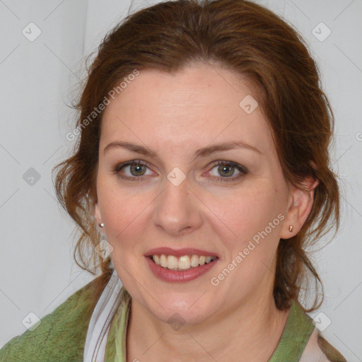 Joyful white young-adult female with medium  brown hair and blue eyes