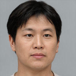 Neutral asian young-adult male with short  brown hair and brown eyes