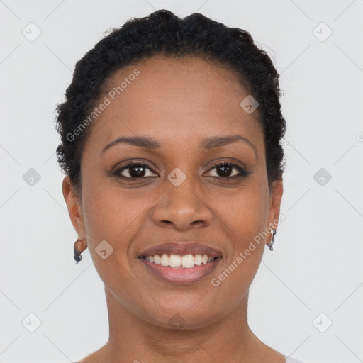 Joyful black young-adult female with short  black hair and brown eyes