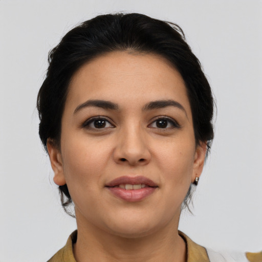 Joyful latino young-adult female with medium  brown hair and brown eyes