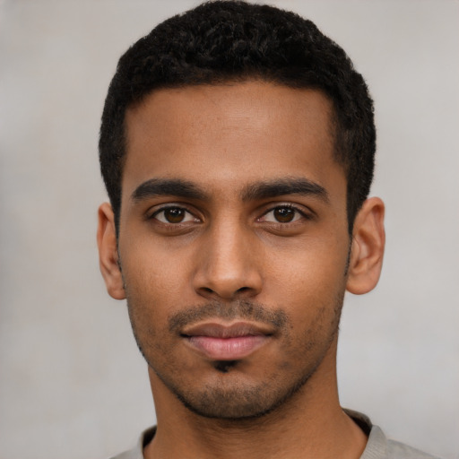 Neutral latino young-adult male with short  black hair and brown eyes
