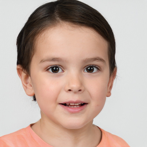 Joyful white child female with short  brown hair and brown eyes