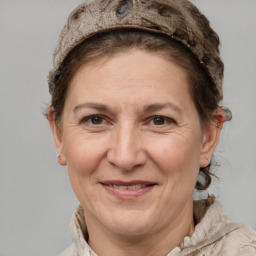 Joyful white adult female with short  brown hair and grey eyes