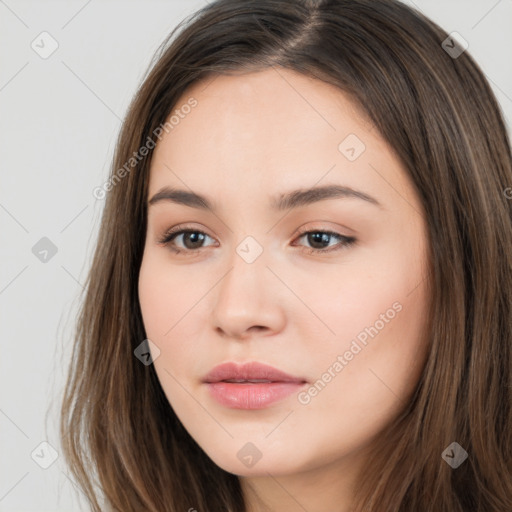 Neutral white young-adult female with long  brown hair and brown eyes