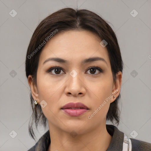 Joyful latino young-adult female with medium  brown hair and brown eyes