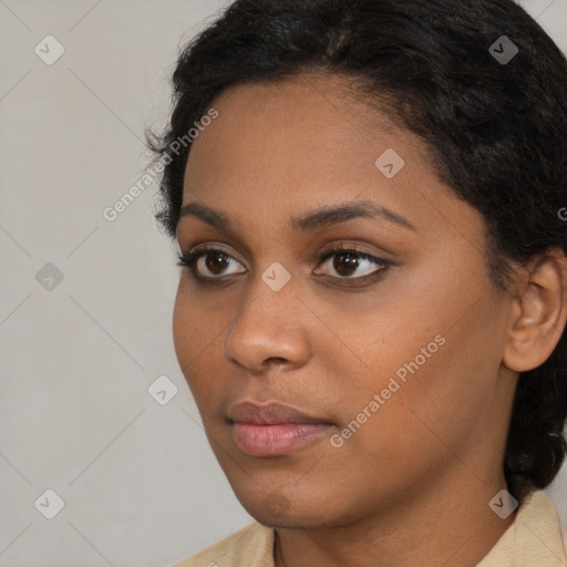 Neutral black young-adult female with long  brown hair and brown eyes