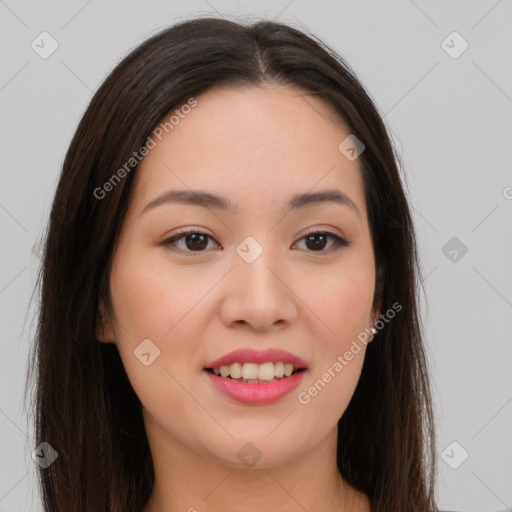 Joyful asian young-adult female with long  brown hair and brown eyes