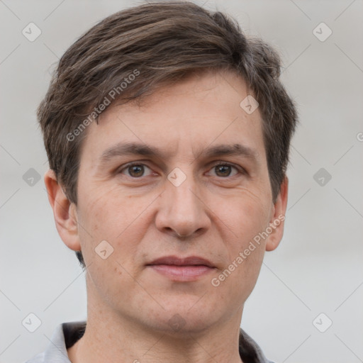 Joyful white adult male with short  brown hair and grey eyes