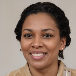 Joyful black young-adult female with medium  brown hair and brown eyes