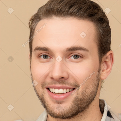 Joyful white young-adult male with short  brown hair and brown eyes