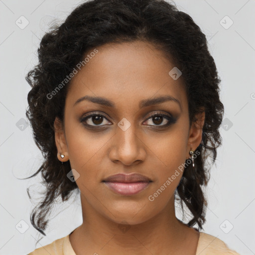 Joyful black young-adult female with long  brown hair and brown eyes