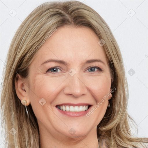 Joyful white adult female with long  brown hair and brown eyes