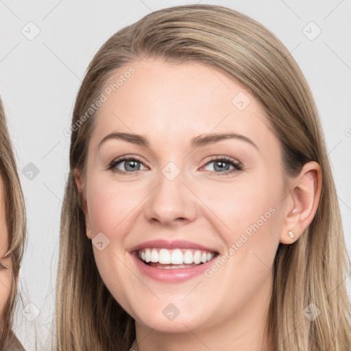 Joyful white young-adult female with long  brown hair and grey eyes