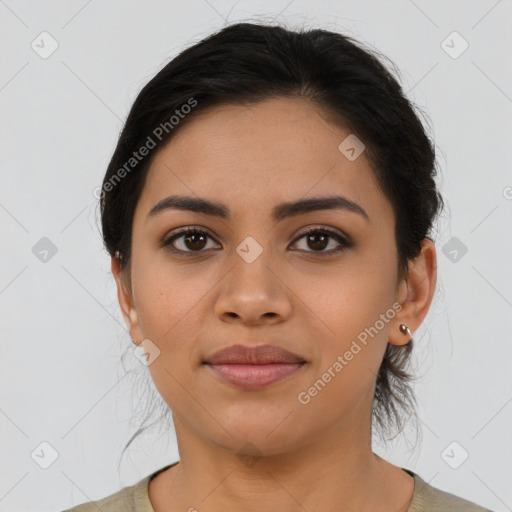 Joyful latino young-adult female with medium  brown hair and brown eyes