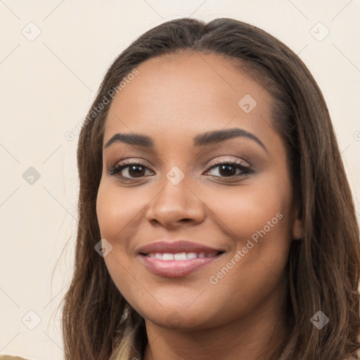 Joyful latino young-adult female with long  brown hair and brown eyes