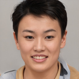 Joyful asian young-adult female with short  brown hair and brown eyes