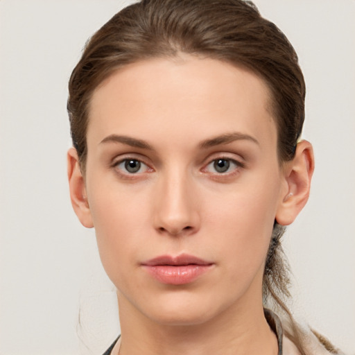 Neutral white young-adult female with medium  brown hair and brown eyes