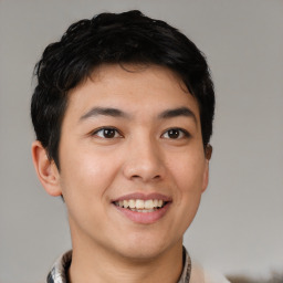 Joyful asian young-adult male with short  black hair and brown eyes