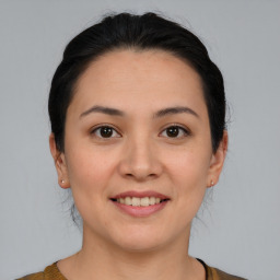 Joyful white young-adult female with medium  brown hair and brown eyes