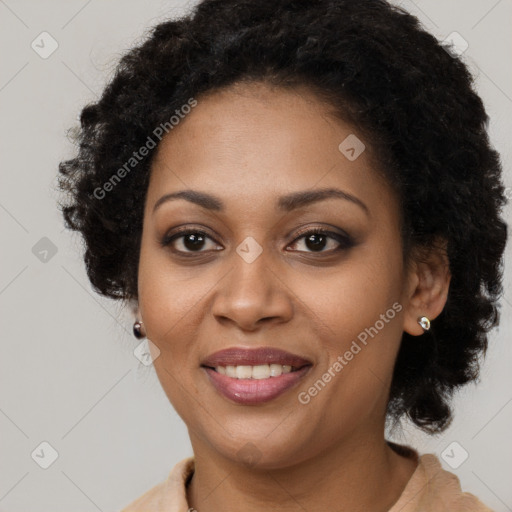 Joyful black young-adult female with long  brown hair and brown eyes