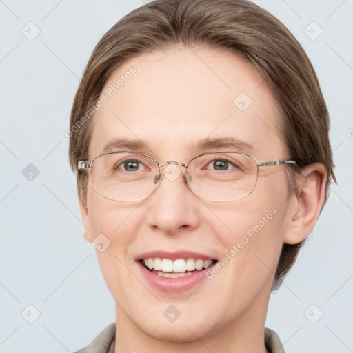 Joyful white adult female with short  brown hair and grey eyes